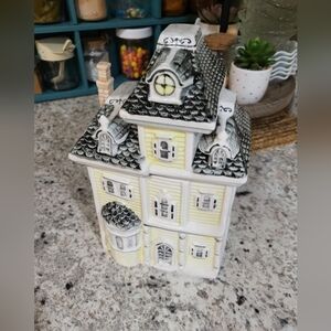 1970’s Yellow And Gray Victorian House Cookie Jar 10 Inches Tall 24 Oz capacity.